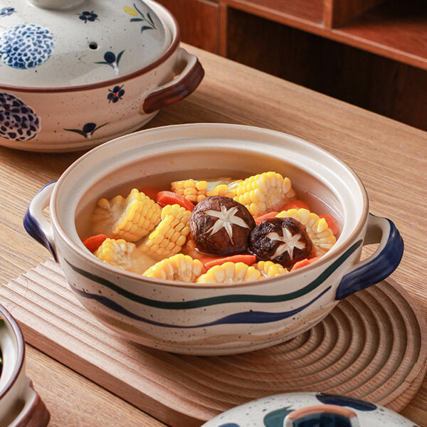 Traditional Japanese ceramic casserole with oriental floral design wabi-sabi aesthetic cookware