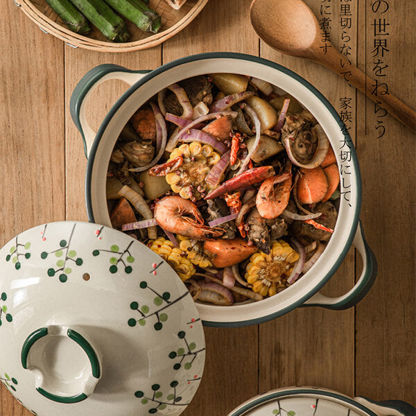 Traditional Japanese donabe ceramic casserole with botanical pattern wabi-sabi aesthetic cookware
