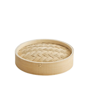 Bamboo steamer basket on a white background