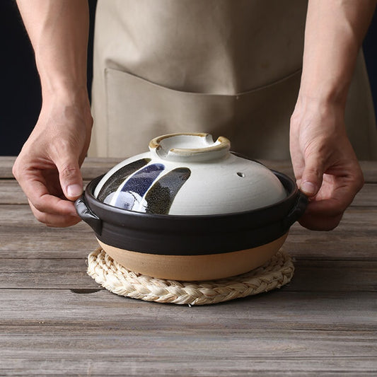 Handcrafted ceramic casserole dish with intricate hand-painted patterns